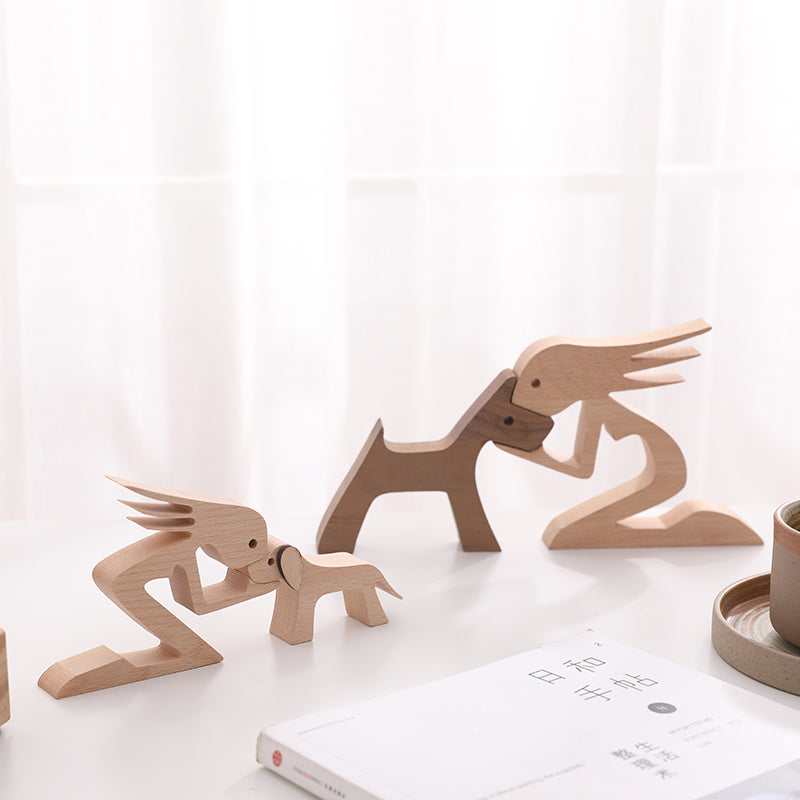 Ornamento di legno umano e cane