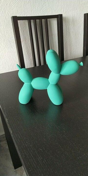 Escultura de perro globo