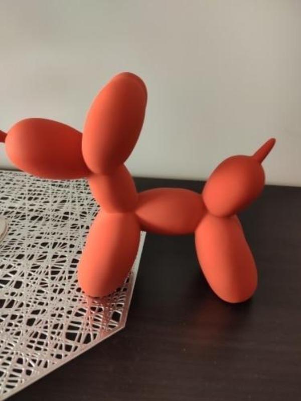 Escultura de perro globo