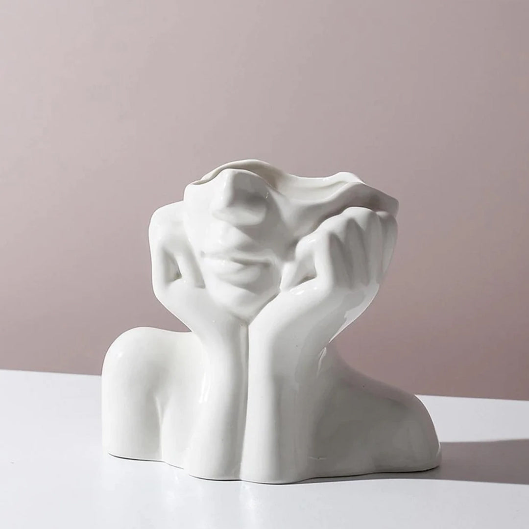 Vase aus Keramik mit menschlichem Gesicht