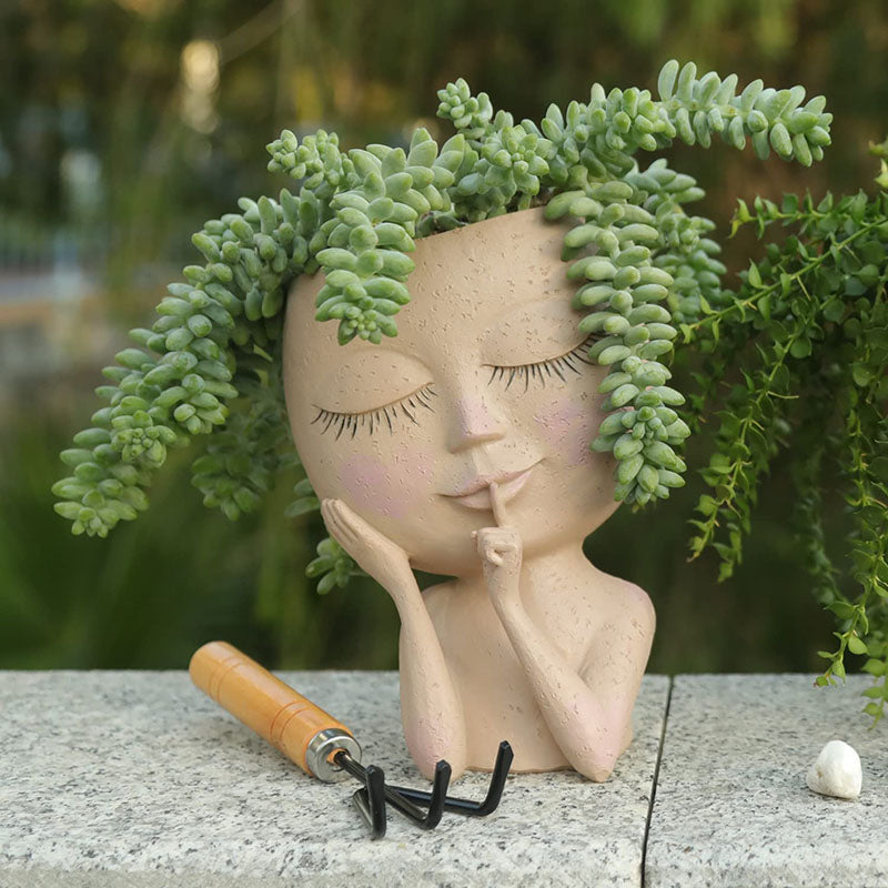 Pots de jardinière visage yeux fermés