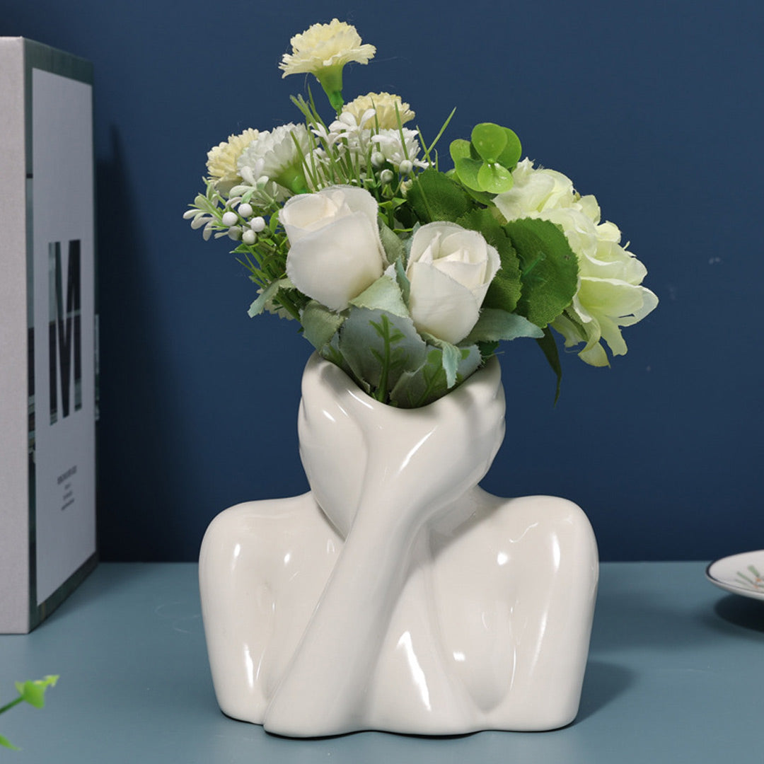 Vase aus Keramik mit menschlichem Gesicht