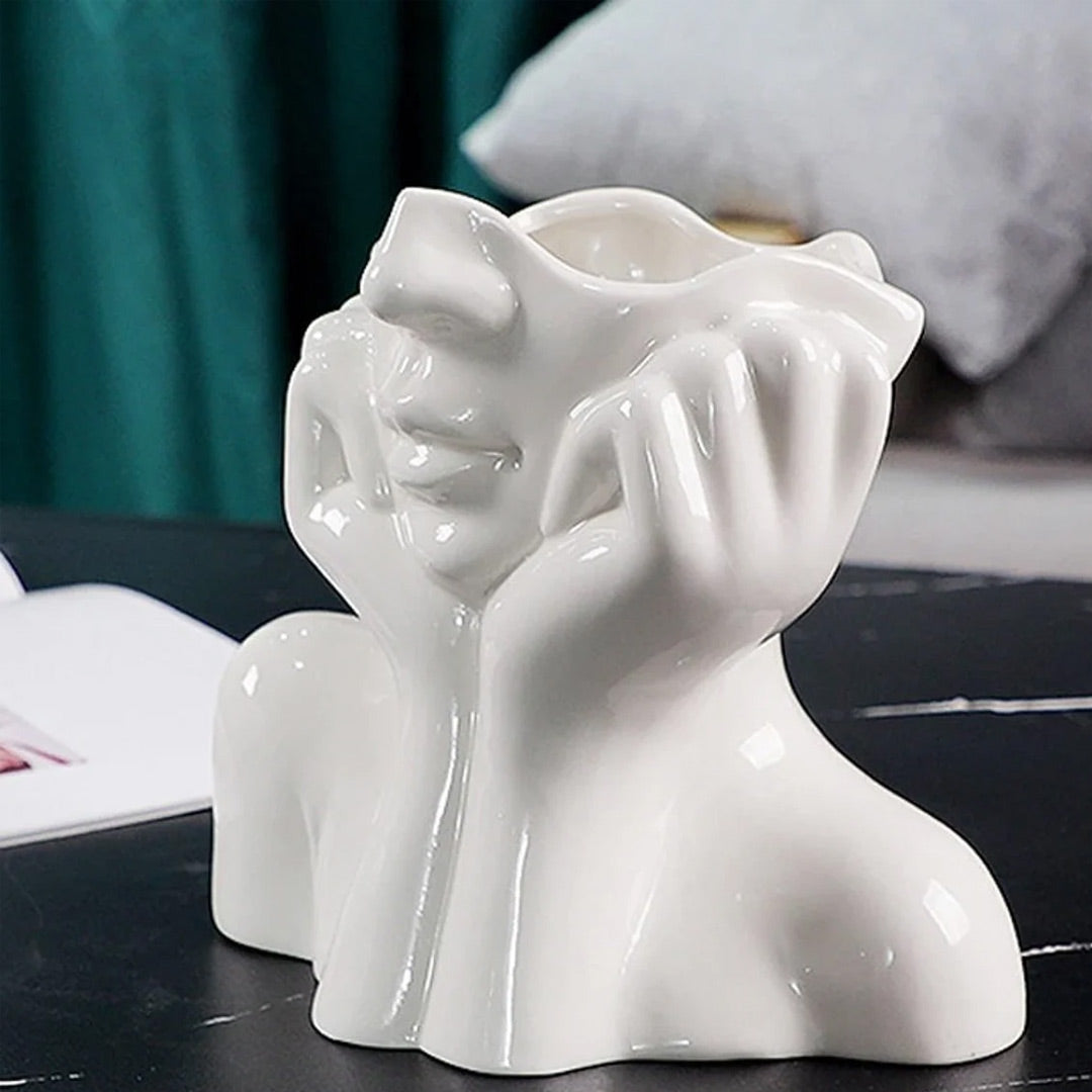 Vase aus Keramik mit menschlichem Gesicht