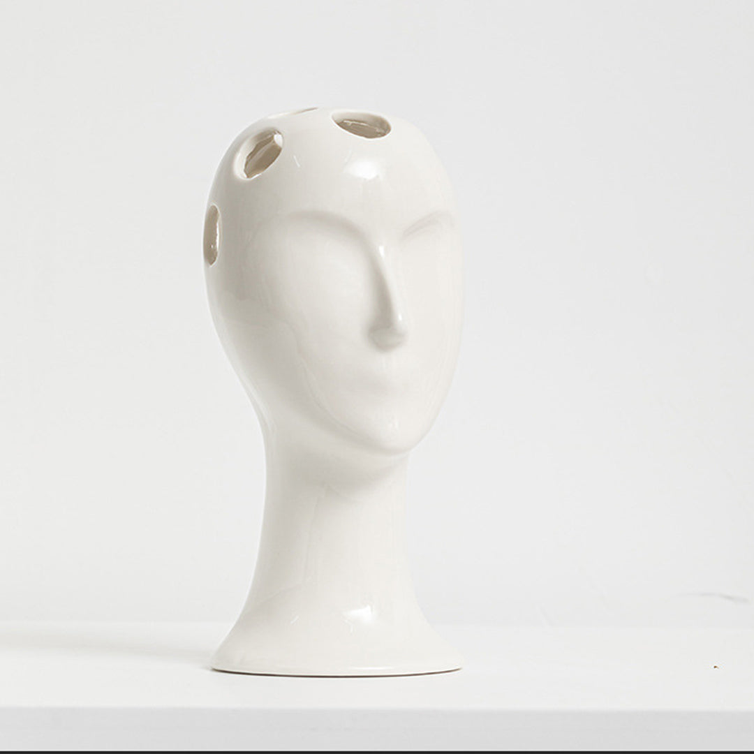 Vase aus Keramik mit menschlichem Gesicht