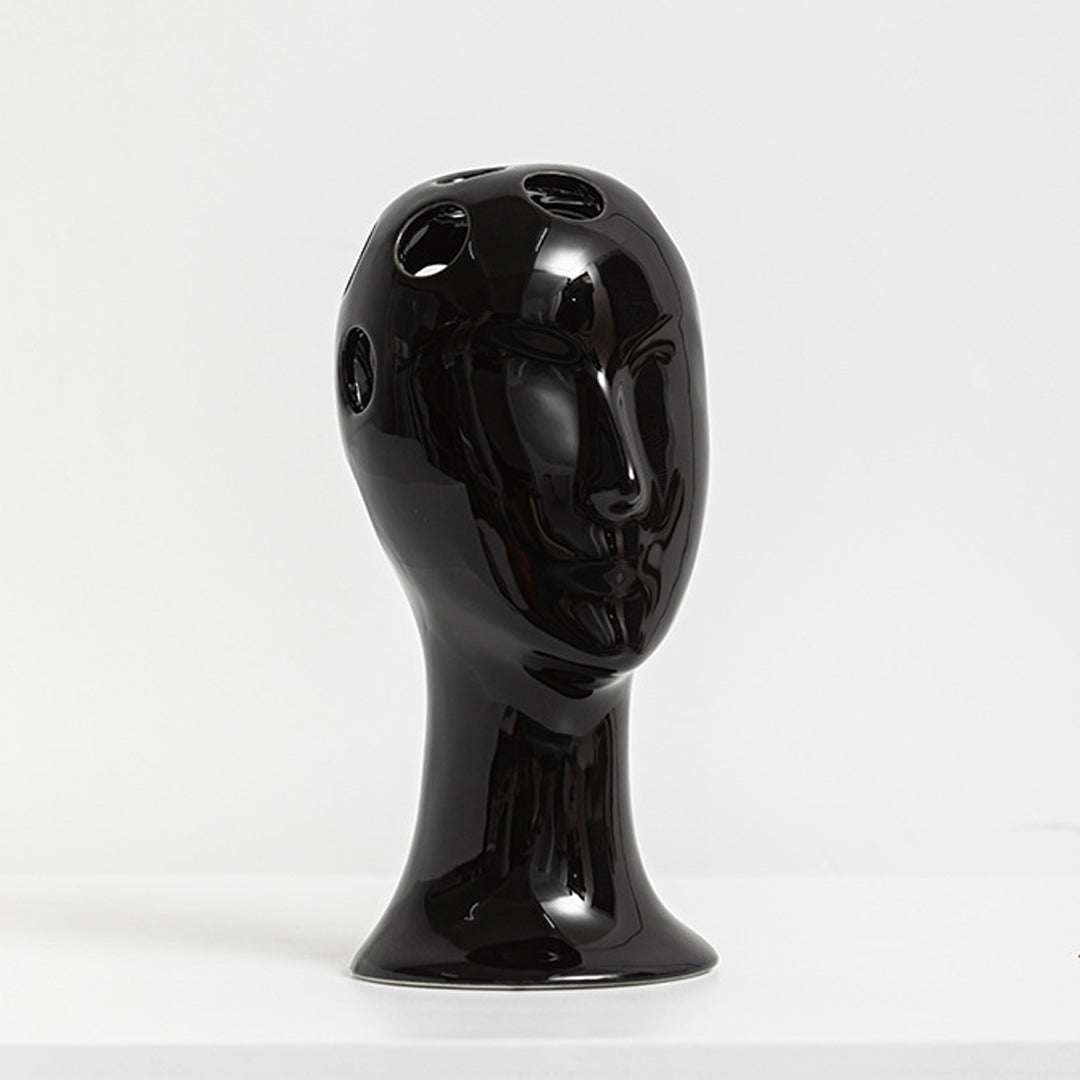 Vase aus Keramik mit menschlichem Gesicht