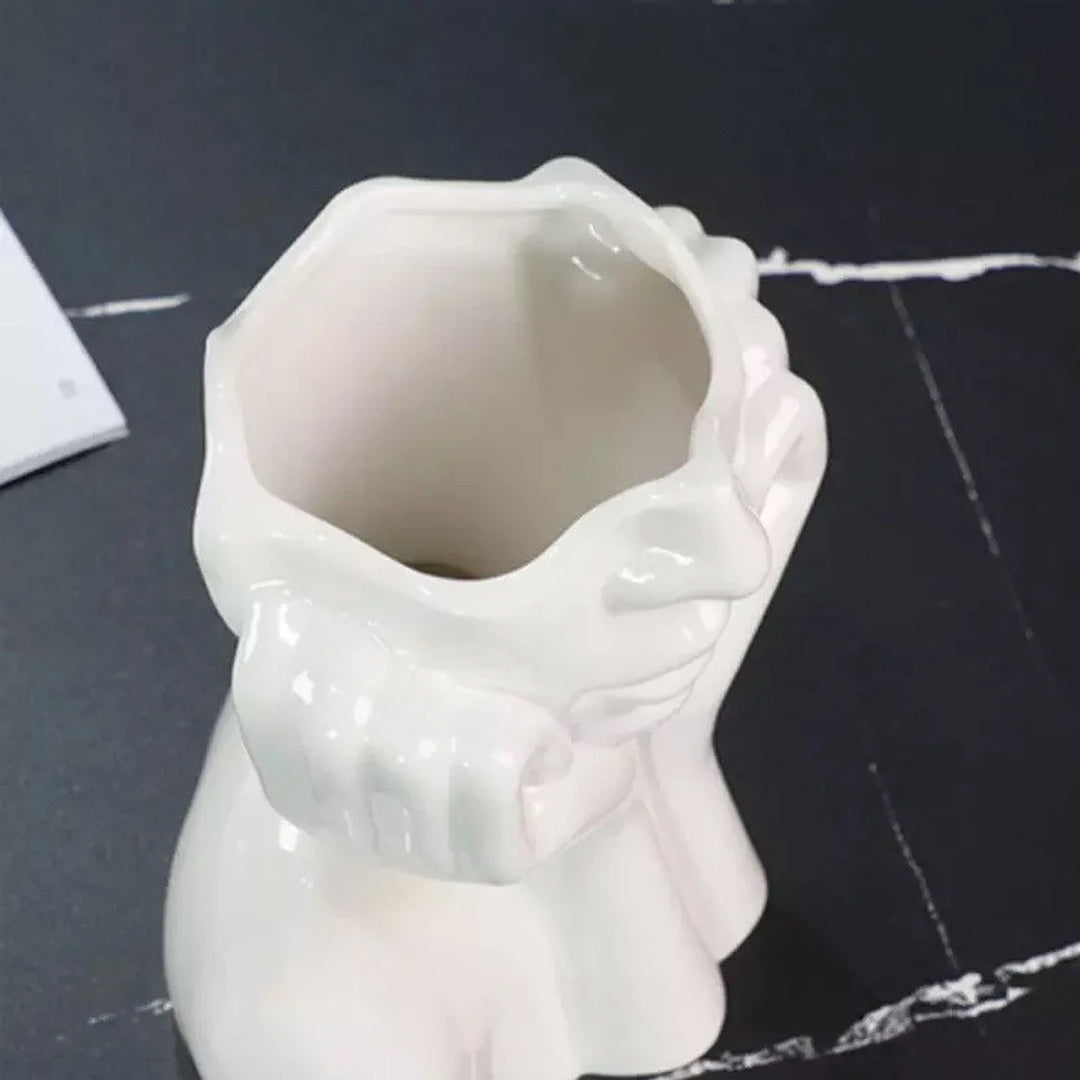 Vase aus Keramik mit menschlichem Gesicht