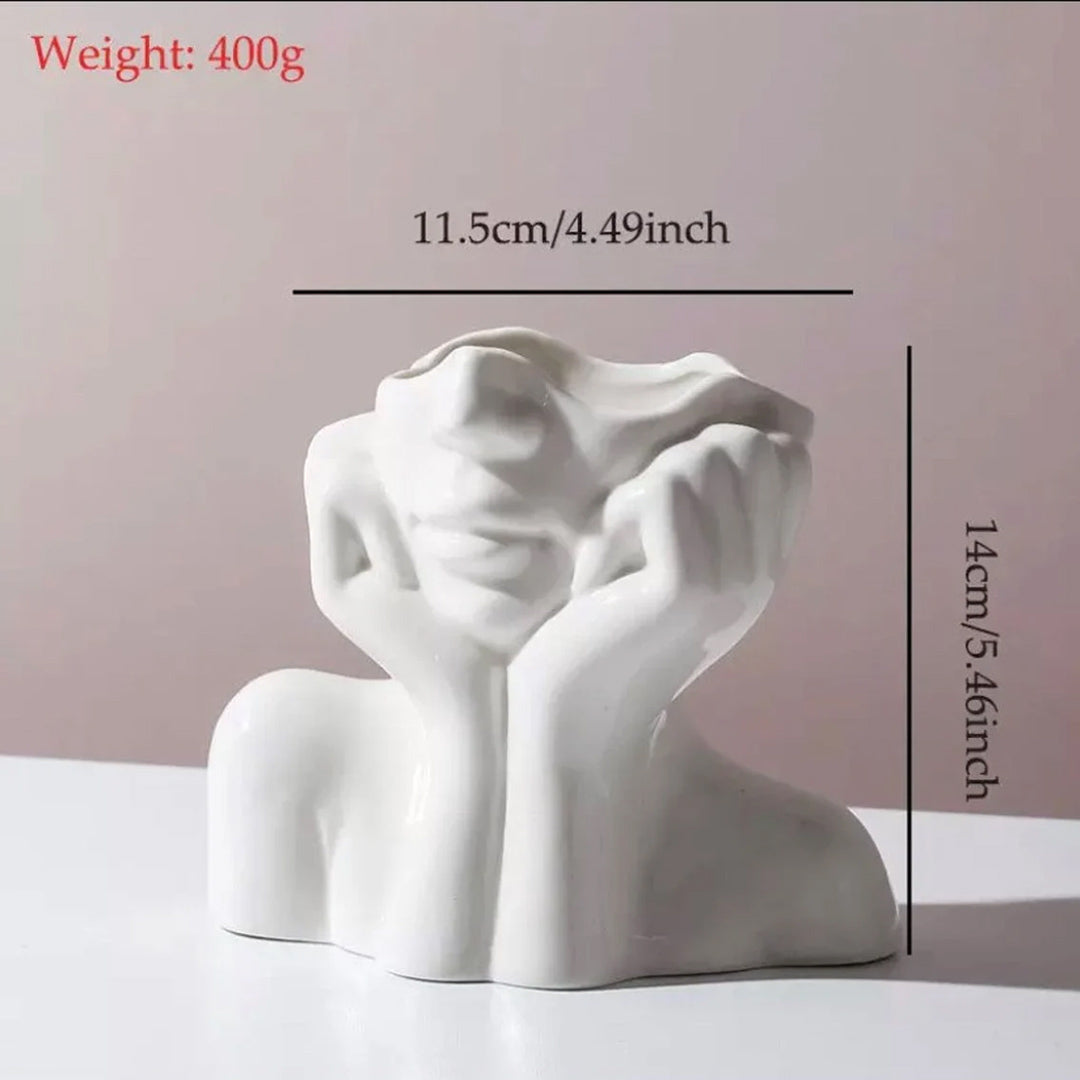 Vase aus Keramik mit menschlichem Gesicht