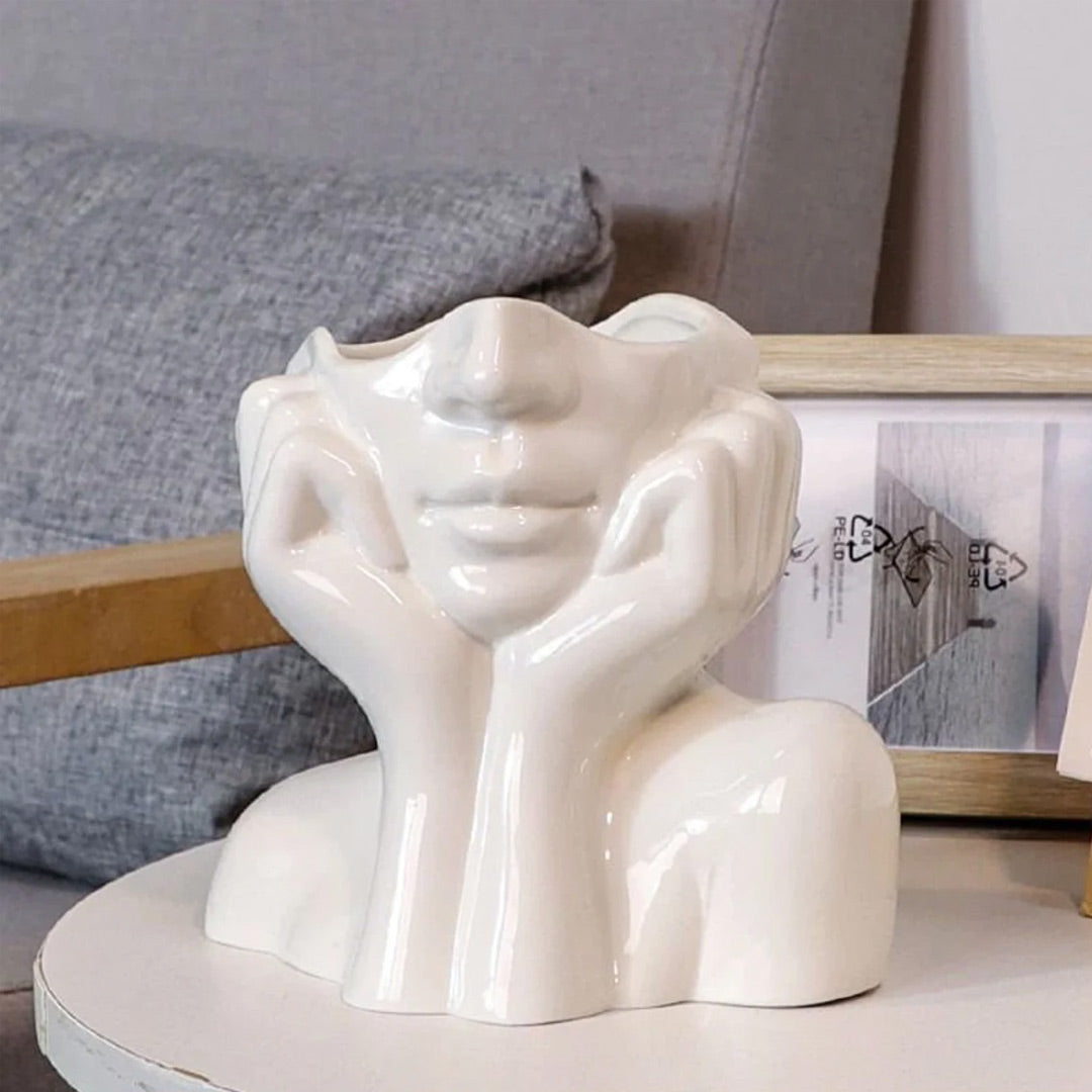 Vase aus Keramik mit menschlichem Gesicht
