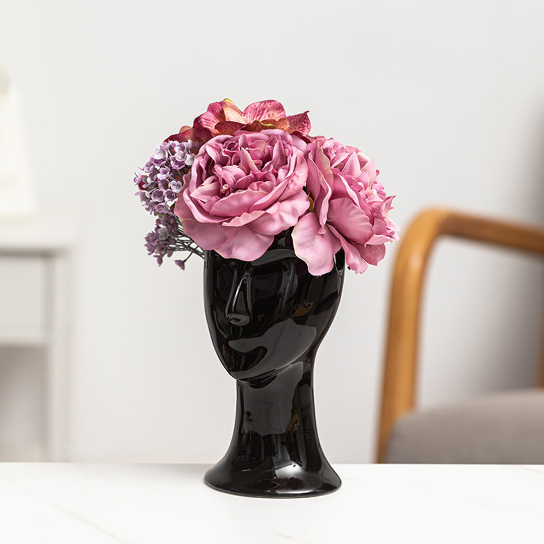 Vase aus Keramik mit menschlichem Gesicht