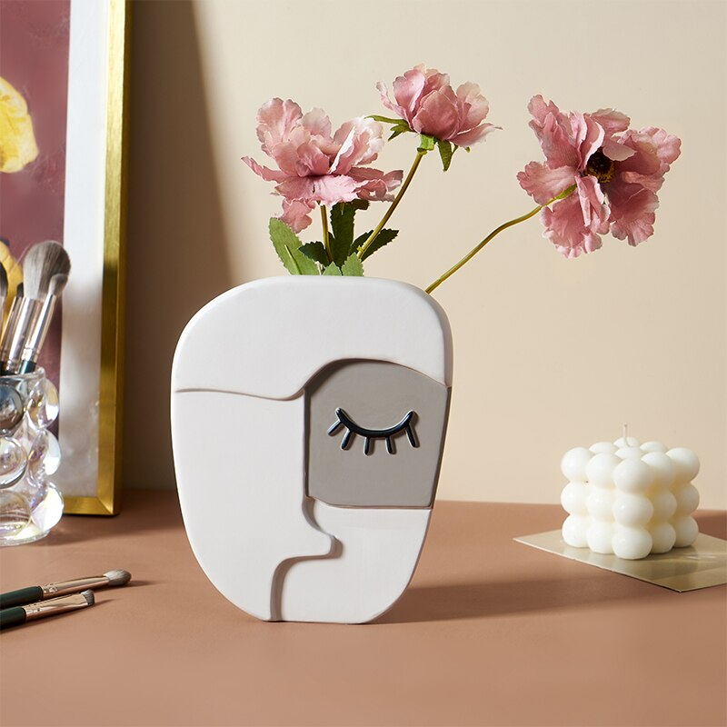 Vase visage humain abstrait