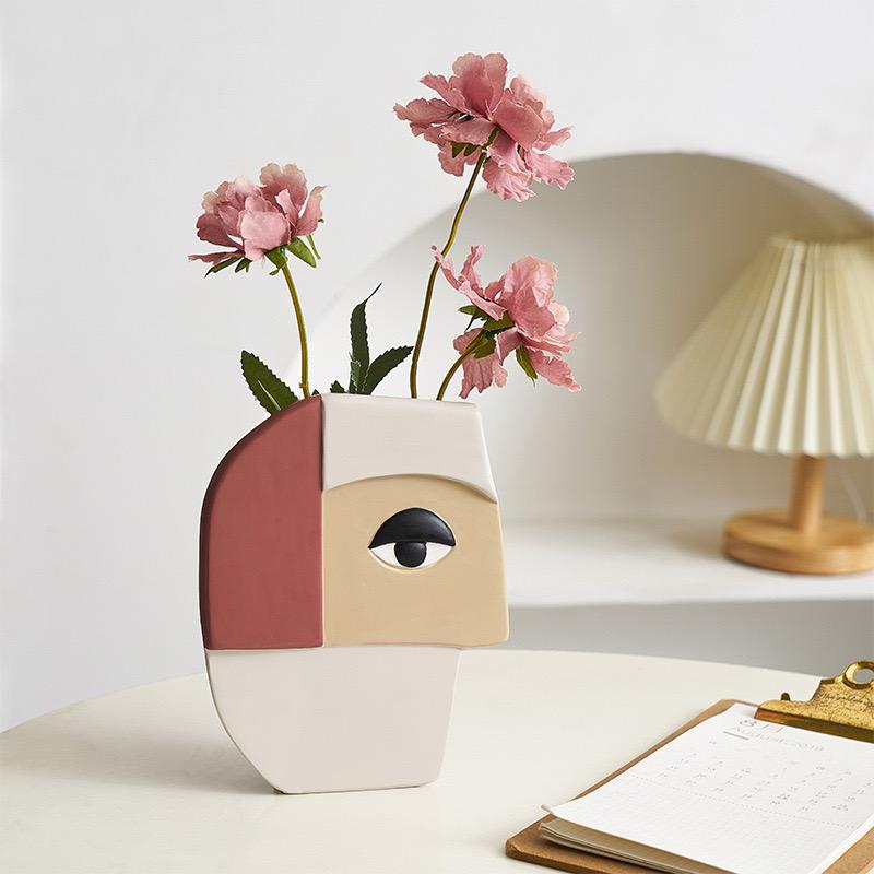 Vase visage humain abstrait