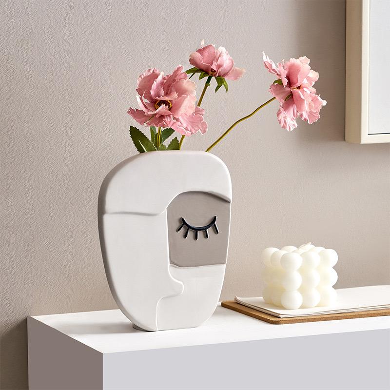 Vase visage humain abstrait