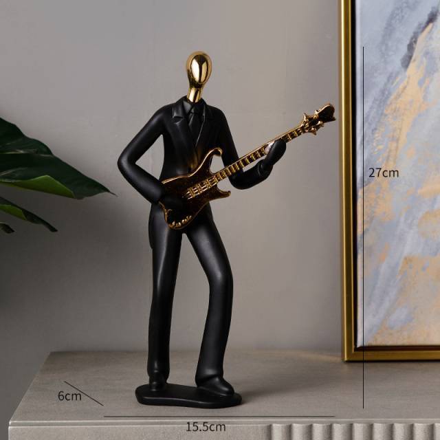 Statuina musicista dorata/nera
