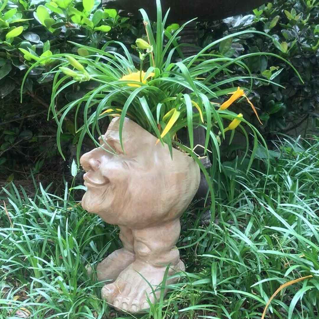 Jardinière de statue de visage moldu