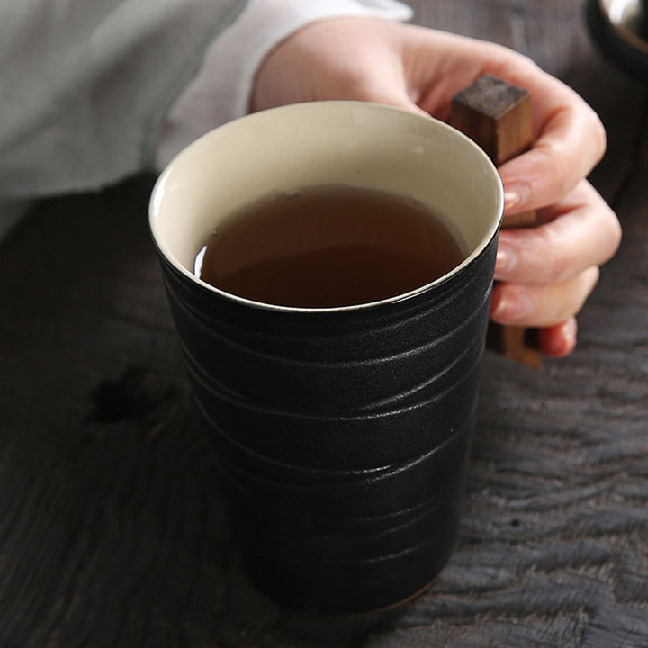 black pottery coffee and tea mug with wooden handle, reusable tea infuser