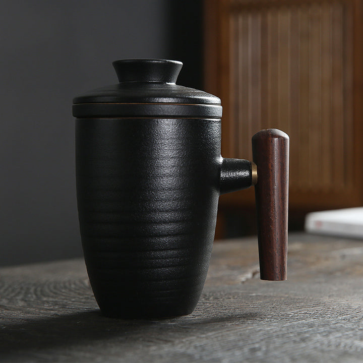 black pottery coffee and tea mug with wooden handle, reusable tea infuser