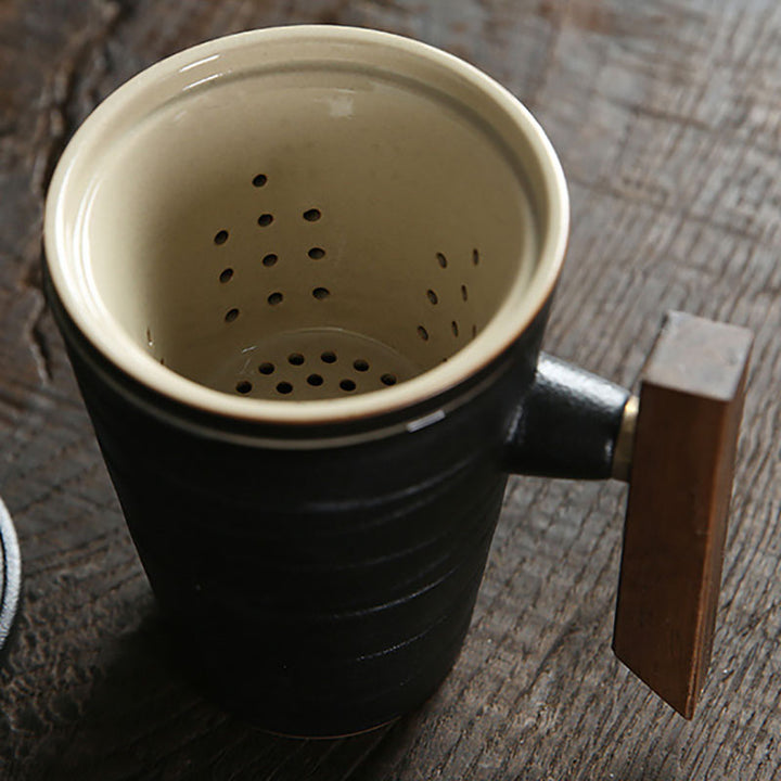 black pottery coffee and tea mug with wooden handle, reusable tea infuser