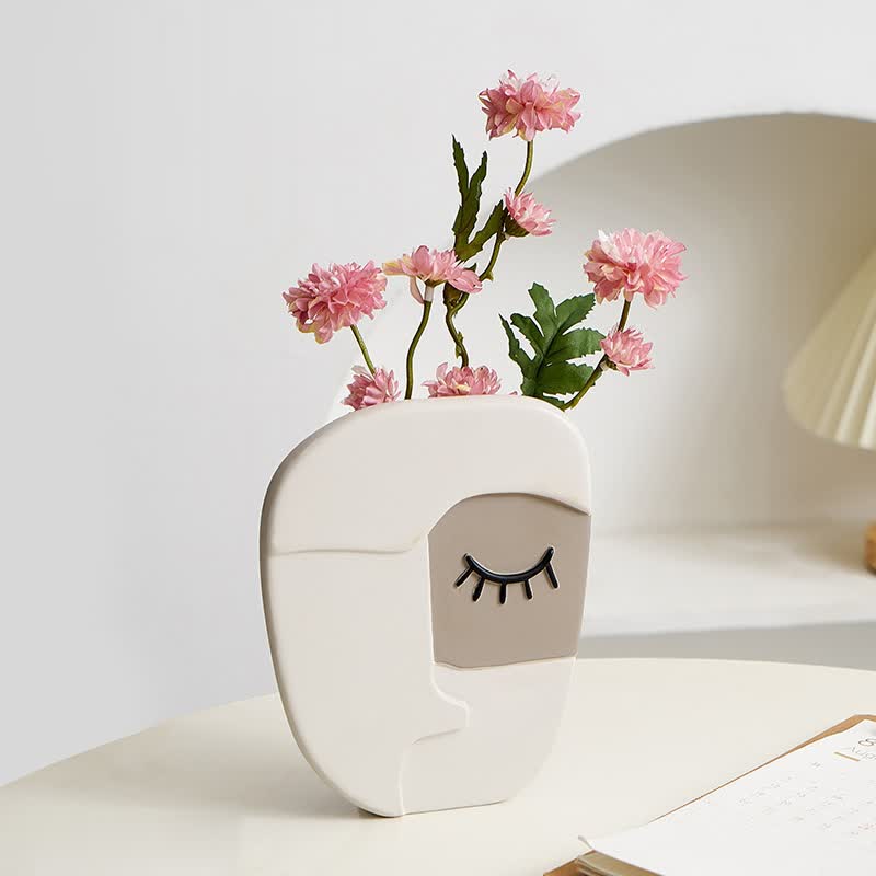 Vase visage humain abstrait