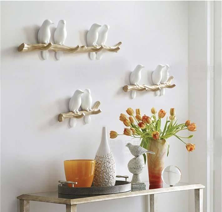 Ganchos de pared para pájaros