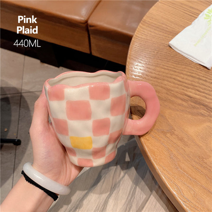 The ceramic checkered mugs, pink white color