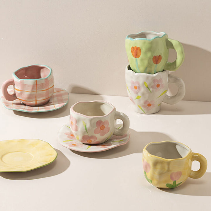 There are ceramic floral mugs