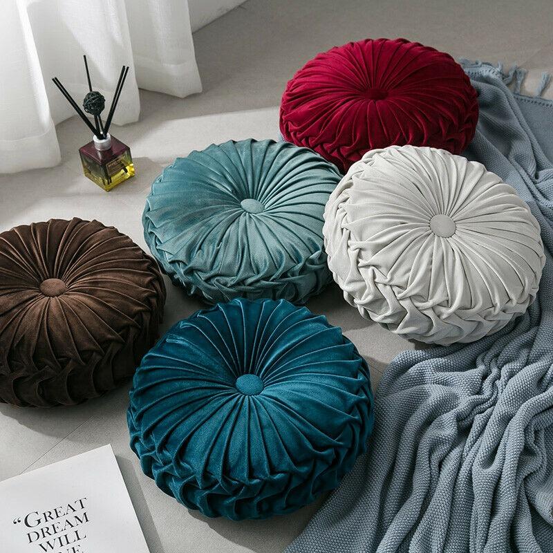 Coussin rond en velours capitonné