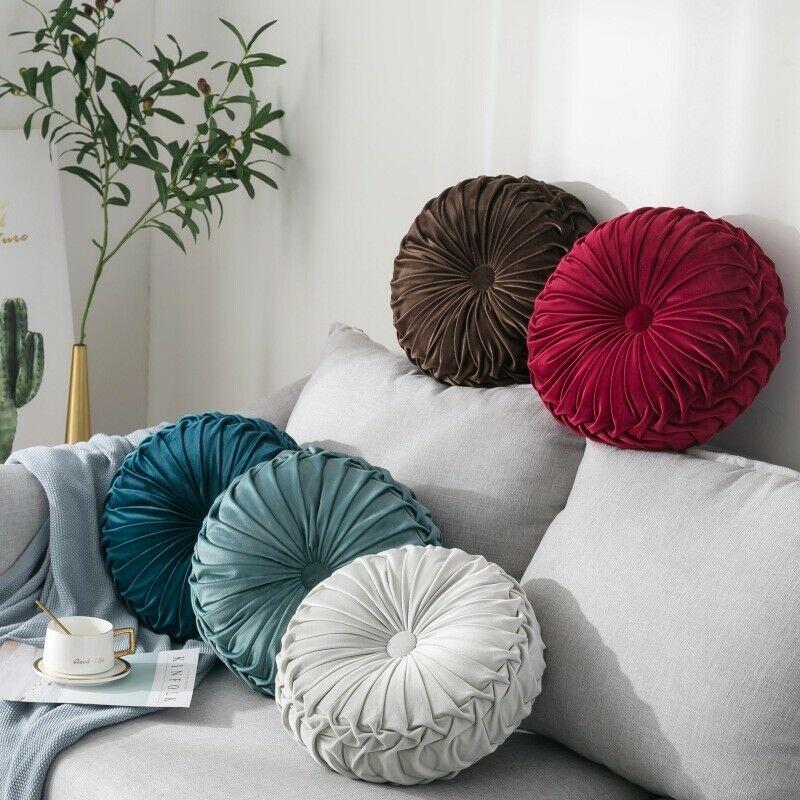 Coussin rond en velours capitonné