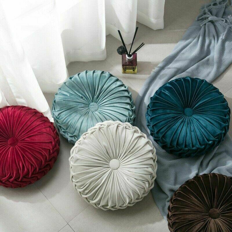 Coussin rond en velours capitonné