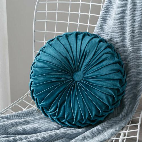 Coussin rond en velours capitonné