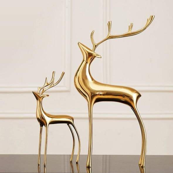 Figuras decorativas de renos dorados