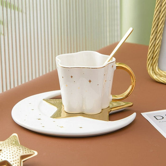 White color, coffee cup with a spoon, saucer with a star-moon design