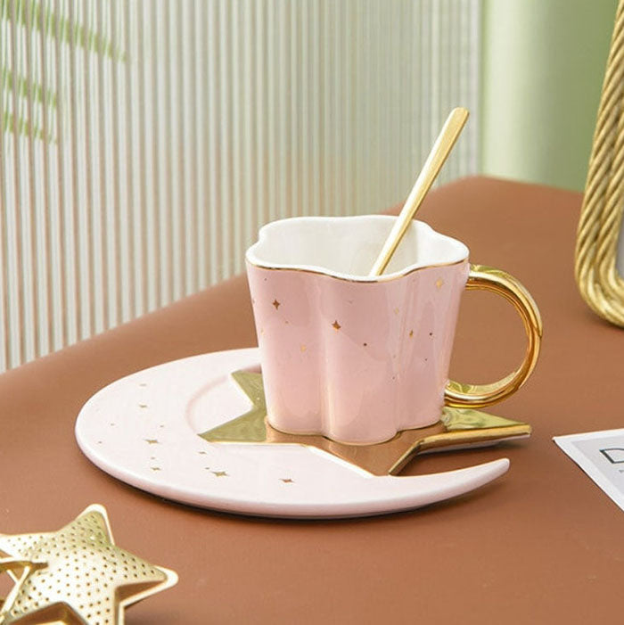 pink color, coffee cup with a spoon, saucer with a star-moon design