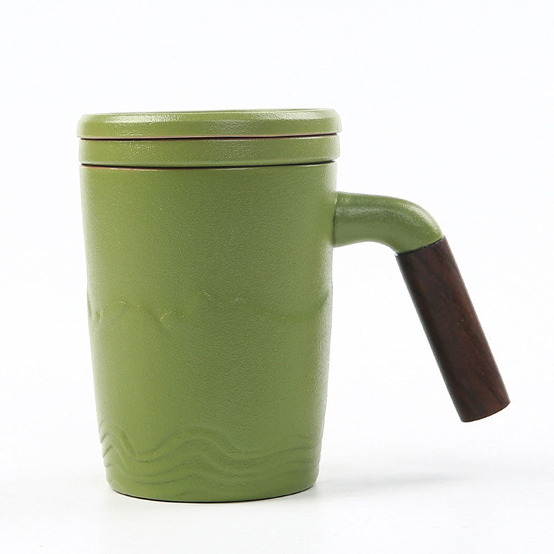 The tall skinny tea mug with lid, saucer and handle, green color