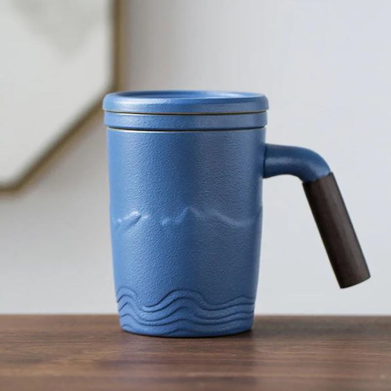 The tall skinny tea mug with lid, saucer and handle, blue color