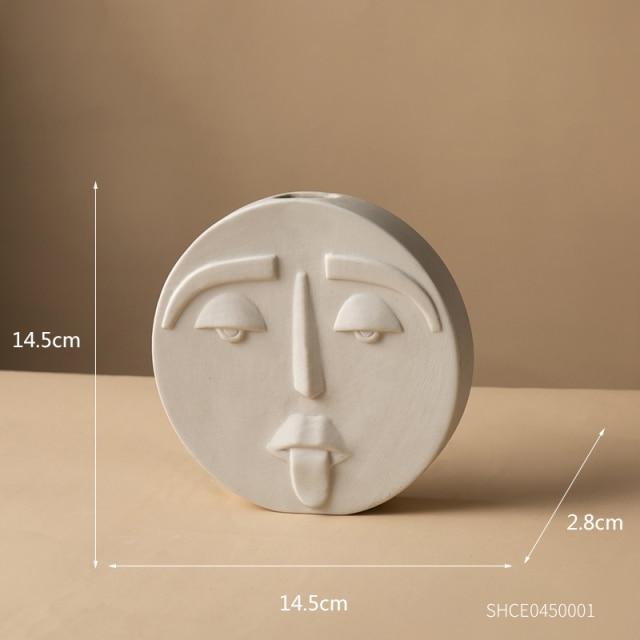 Jarrón de cerámica con cara abstracta