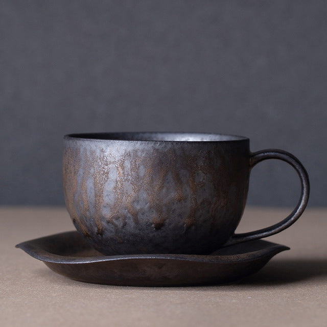 vintage rust glaze tea cups and round saucer